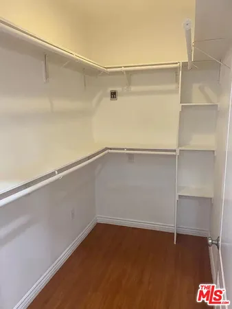 a view of an empty walk in closet