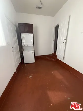 an empty room with a mirror