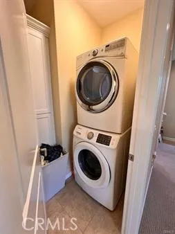 a utility room with a bed and a machine