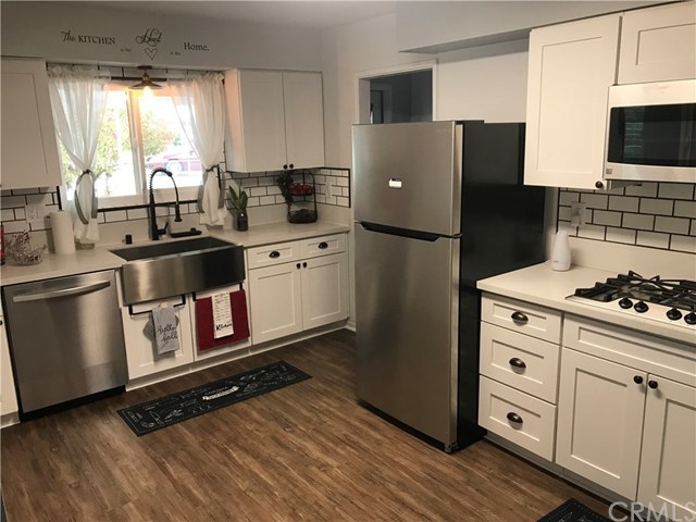 28864 Murrieta Road Menifee, CA 92586 - Photo 1 of 1 Stunning Kitchen Remodel to include ALL Stainless Steel Appliances, Farmhouse Sink, Oil Rubbed Bronze Faucet, Hardware and Light Fixtures, Newly Installed White, Quiet Close Cabinets, New Windows, Updated Pantry with New Door & LVP Flooring installed.