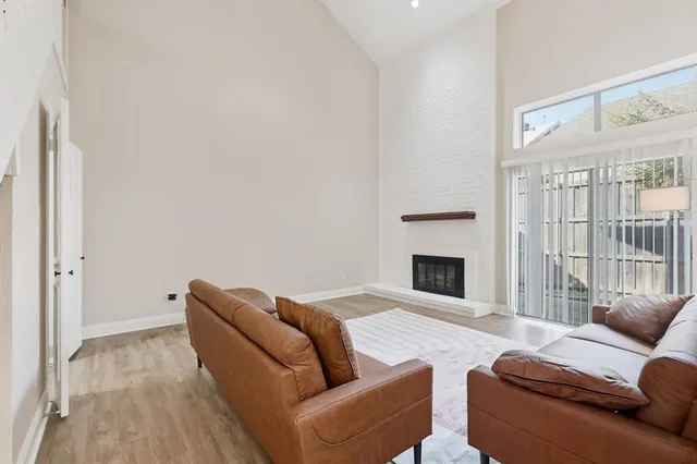 a living room with furniture fireplace and a flat screen tv