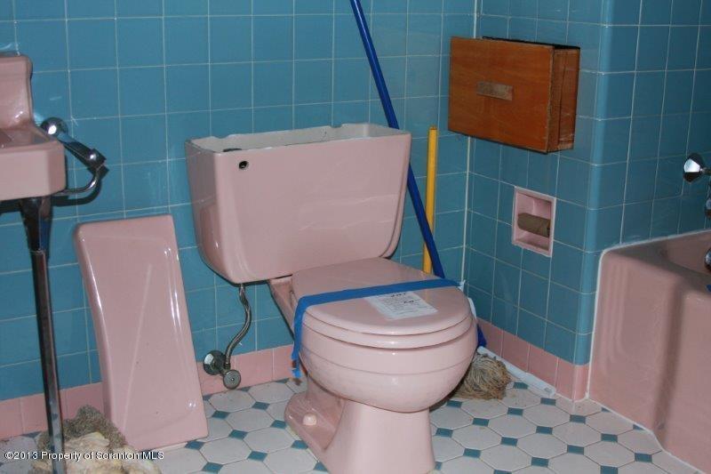 1424 Jackson Street Scranton, PA 18504 - Photo 21 of 35 a bathroom with a toilet and a mirror