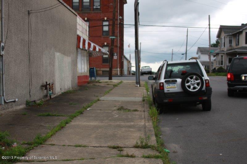1424 Jackson Street Scranton, PA 18504 - Photo 8 of 35 a view of a car parked in front of a house