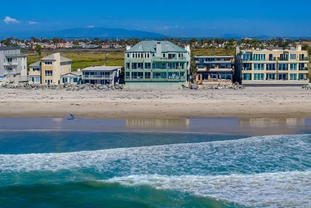 a view of a swimming pool with lawn chairs