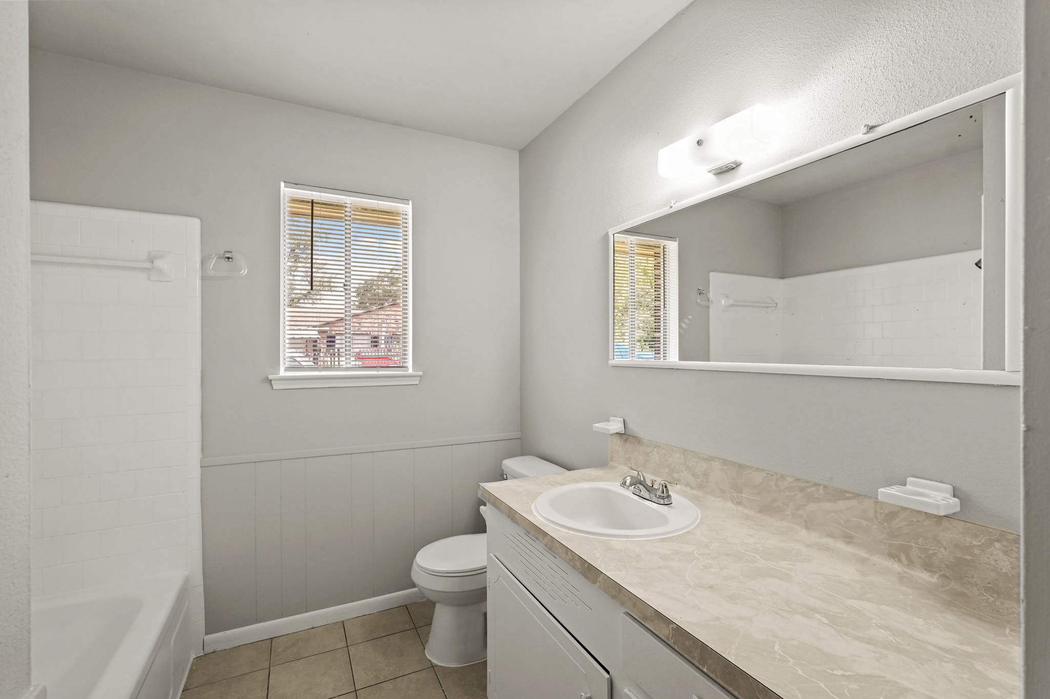 1802 Mosher Lane Houston, TX 77088 - Photo 16 of 18 a bathroom with a granite countertop sink mirror vanity and toilet