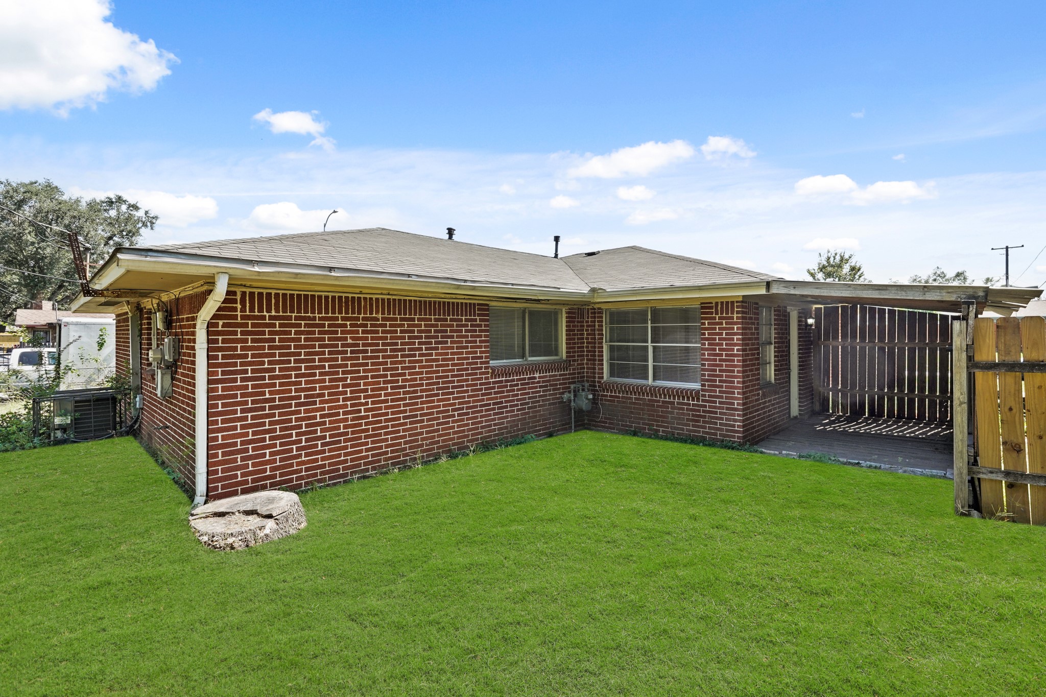 1802 Mosher Lane Houston, TX 77088 - Photo 17 of 18 a view of a house with a yard and deck