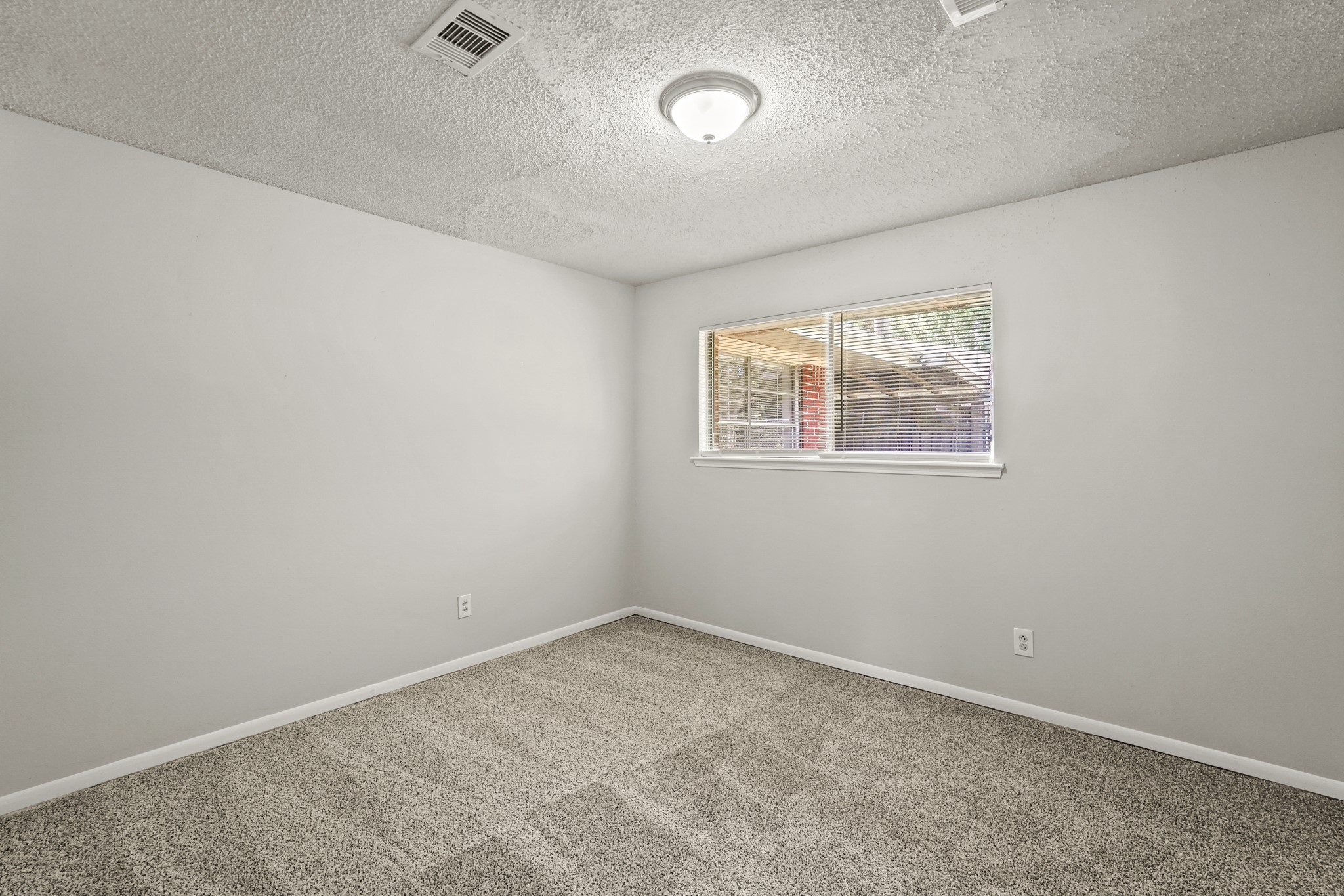 1802 Mosher Lane Houston, TX 77088 - Photo 6 of 18 an empty room with windows