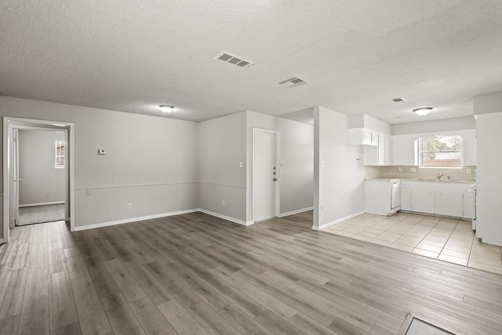 1802 Mosher Lane Houston, TX 77088 - Photo 10 of 18 a view of a kitchen with wooden floor and a kitchen