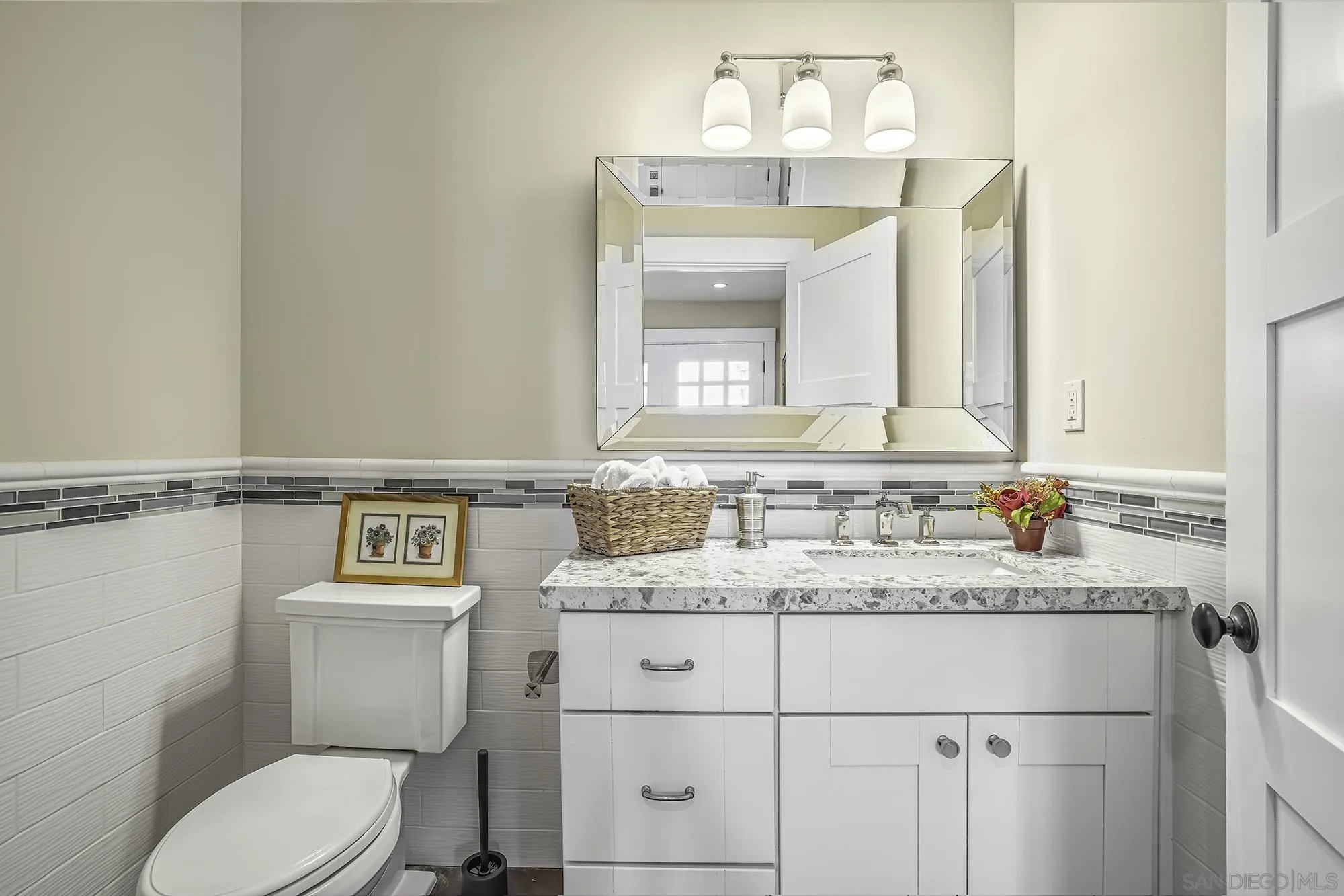2826 Palomino Circle La Jolla, CA 92037 - Photo 23 of 34 a bathroom with a granite countertop toilet sink mirror and vanity