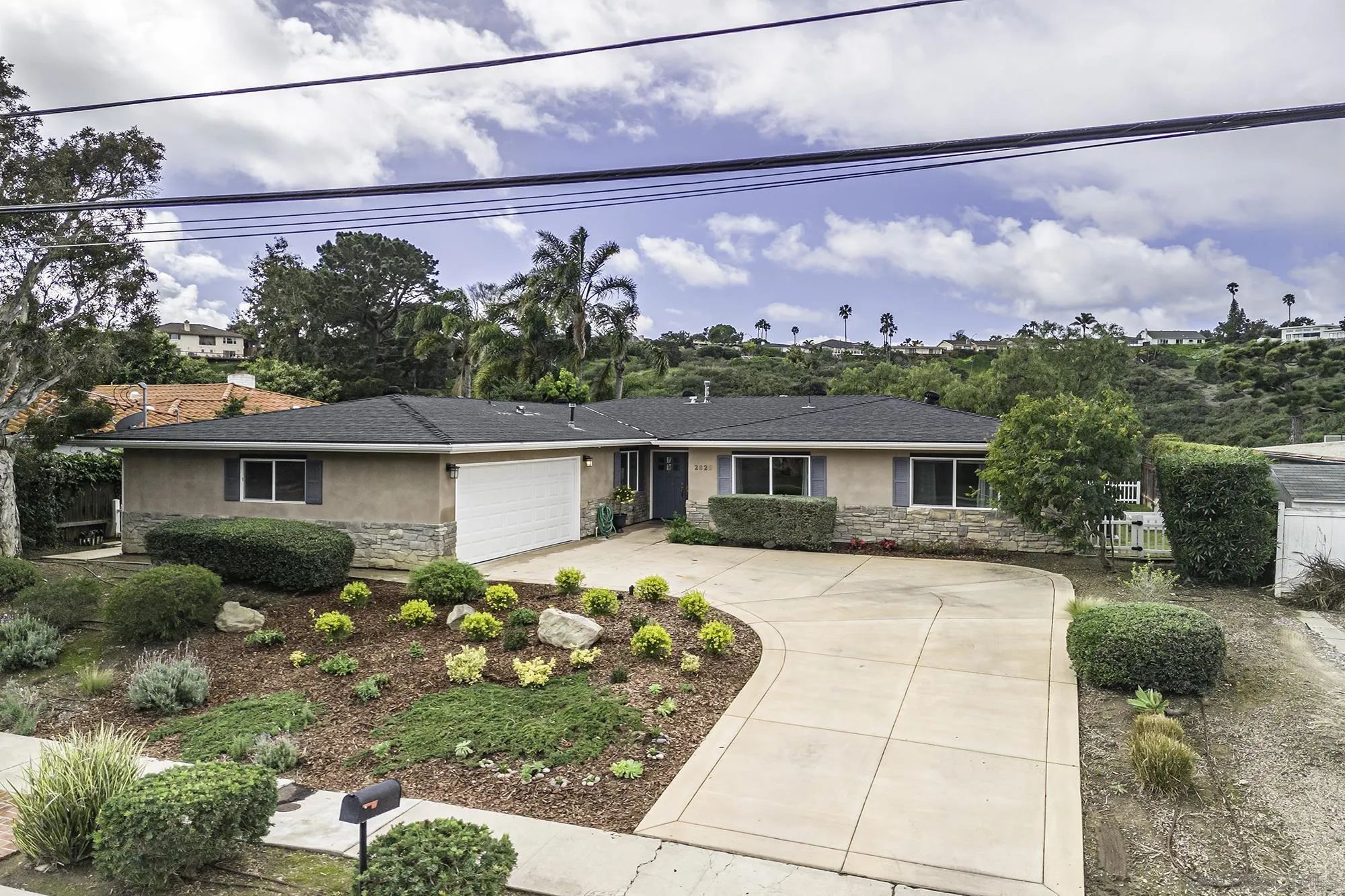 2826 Palomino Circle La Jolla, CA 92037 - Photo 27 of 34 a front view of a house with garden