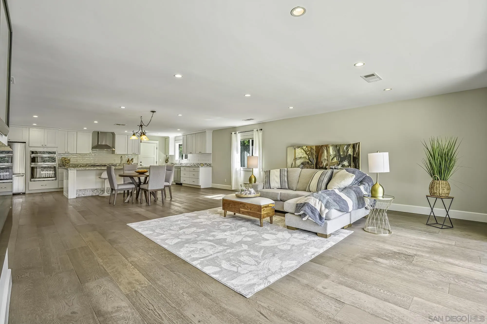 2826 Palomino Circle La Jolla, CA 92037 - Photo 6 of 34 a living room with furniture and kitchen view with wooden floor