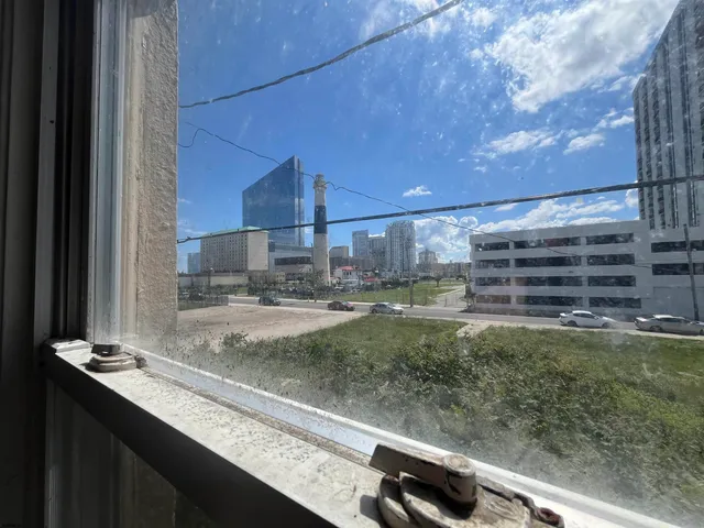 a view of a kitchen with a sink and a window