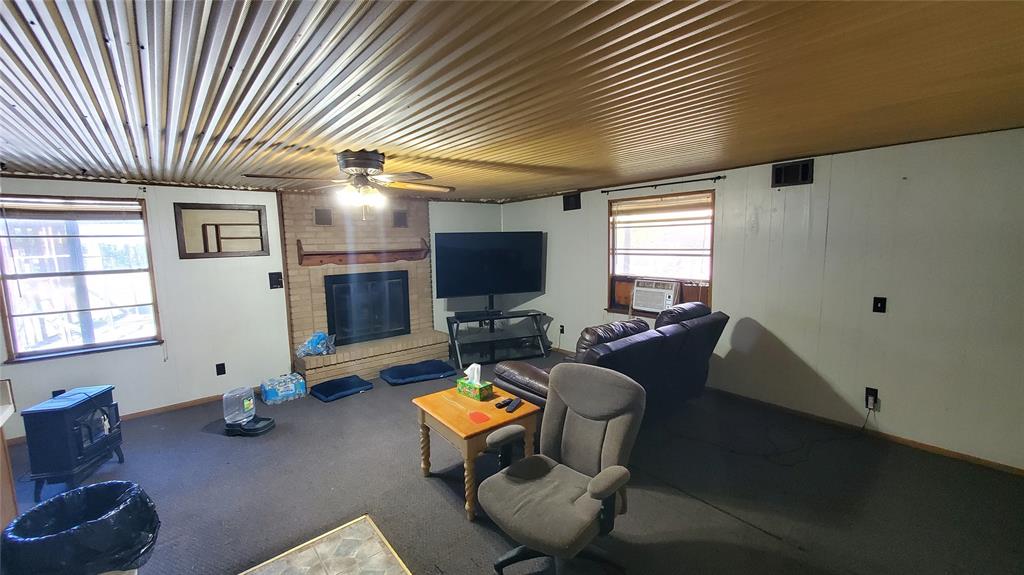 310 County Road 2406 Tool, TX 75143 - Photo 16 of 26 a living room with furniture window and a flat screen tv