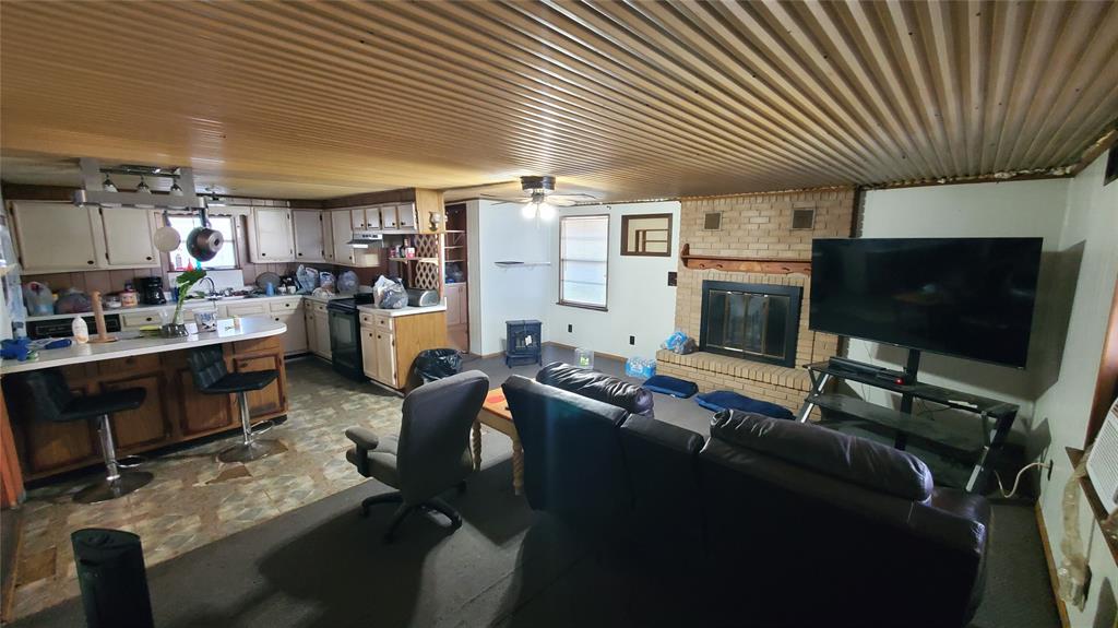 310 County Road 2406 Tool, TX 75143 - Photo 18 of 26 a living room with furniture and a flat screen tv