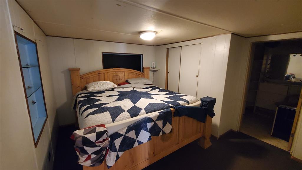 310 County Road 2406 Tool, TX 75143 - Photo 19 of 26 a bedroom with a bed and a mirror