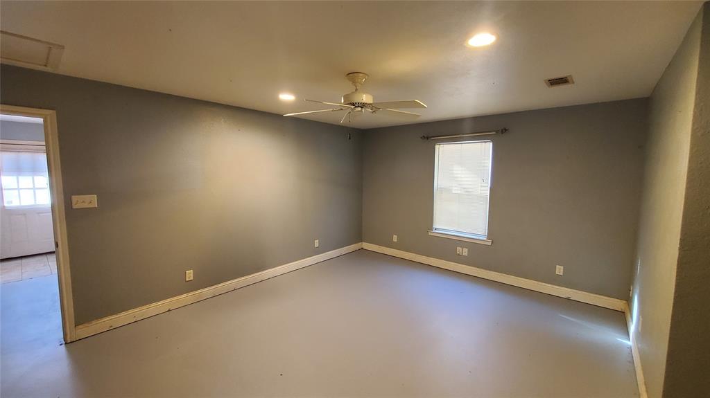 310 County Road 2406 Tool, TX 75143 - Photo 26 of 26 an empty room with a window and ceiling fan