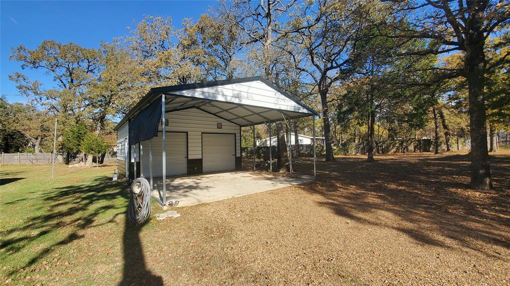 310 County Road 2406 Tool, TX 75143 - Photo 3 of 26 a view of a house with a yard