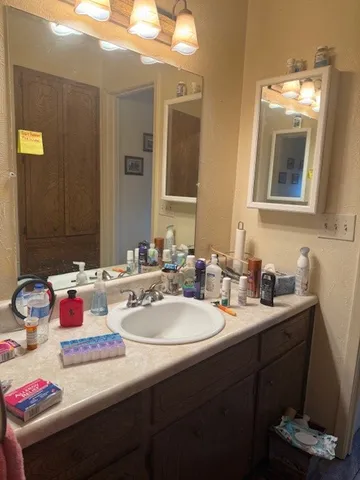 a bathroom with a sink and a mirror