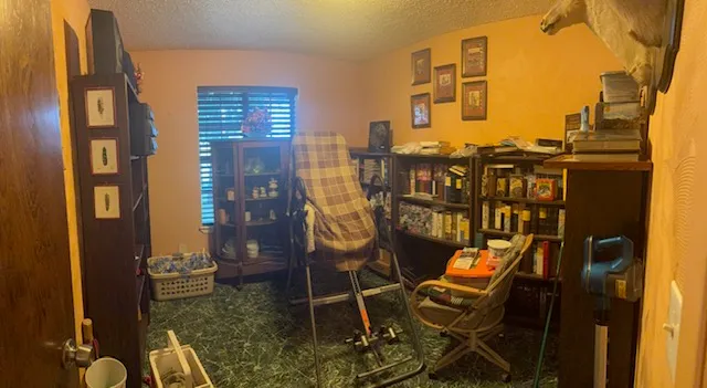 a view of a balcony with chairs