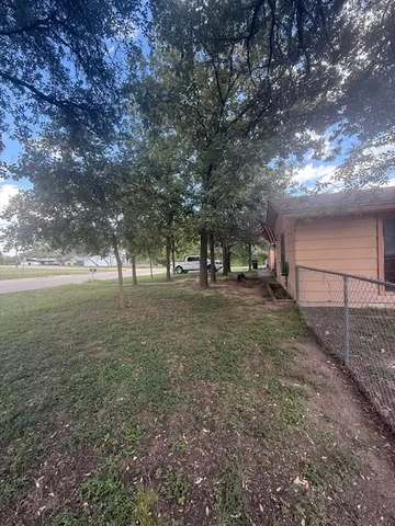 a view of backyard with green space