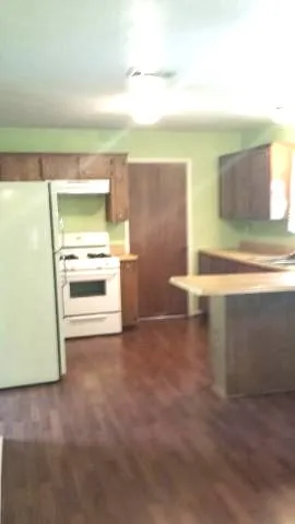a view of a kitchen with a sink