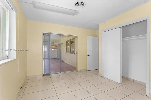a view of an empty room and window