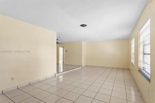 a view of an empty room and window