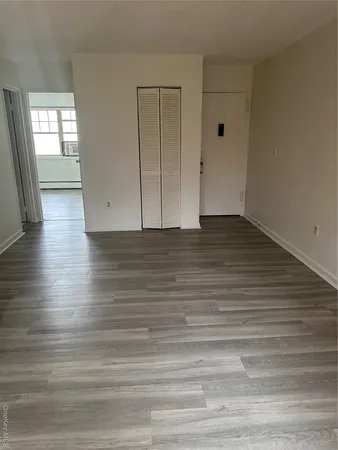 a view of a livingroom with wooden floor