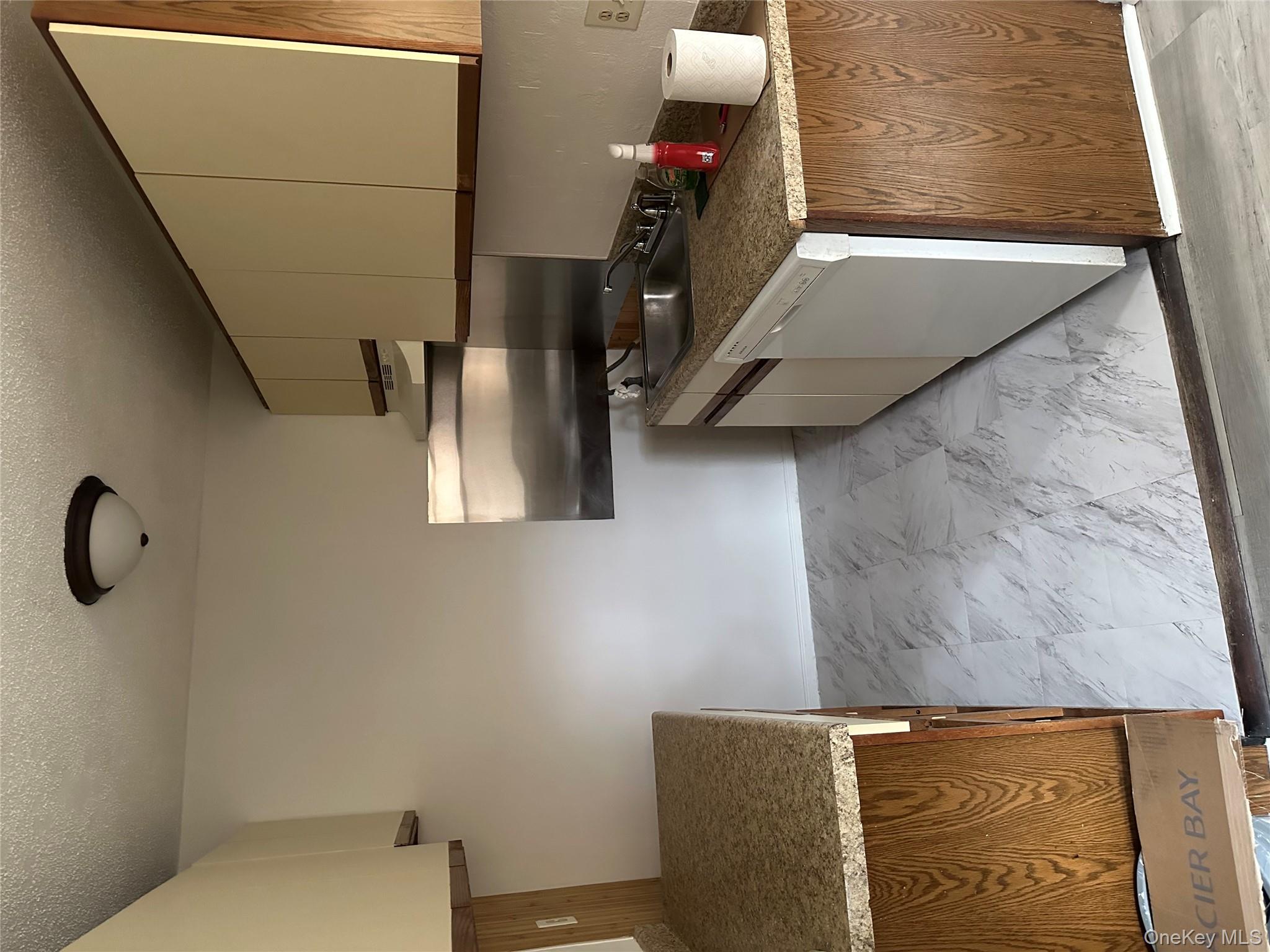 603 Barclay Manor, Unit 6C Newburgh, NY 12550 - Photo 3 of 7 a kitchen with stainless steel appliances granite countertop a stove a sink and a microwave