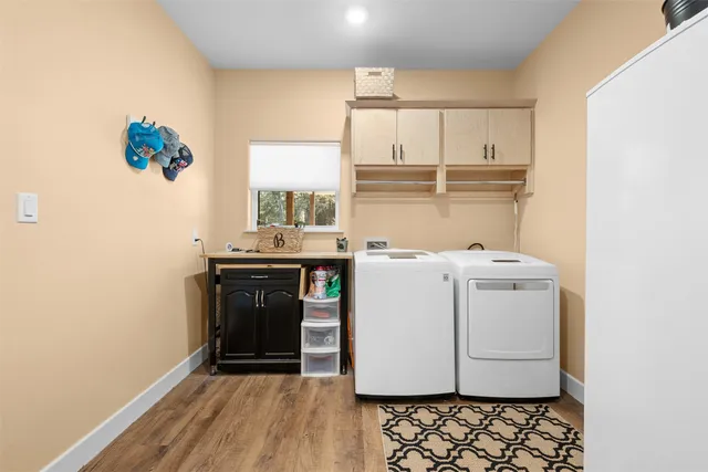 a view of a backyard with table and chairs and potted plants