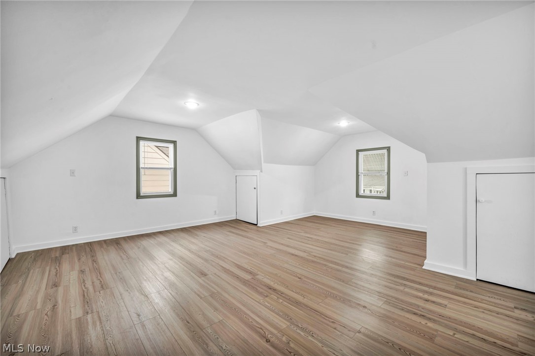 1609 Mapledale Road Wickliffe, OH 44092 - Photo 23 of 46 Bonus room featuring wood-type flooring and vaulted ceiling
