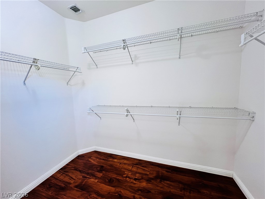 3047 Hickory Valley Road Henderson, NV 89052 - Photo 18 of 33 Ample shelving in this walk-in closet offers extensive storage possibilities.