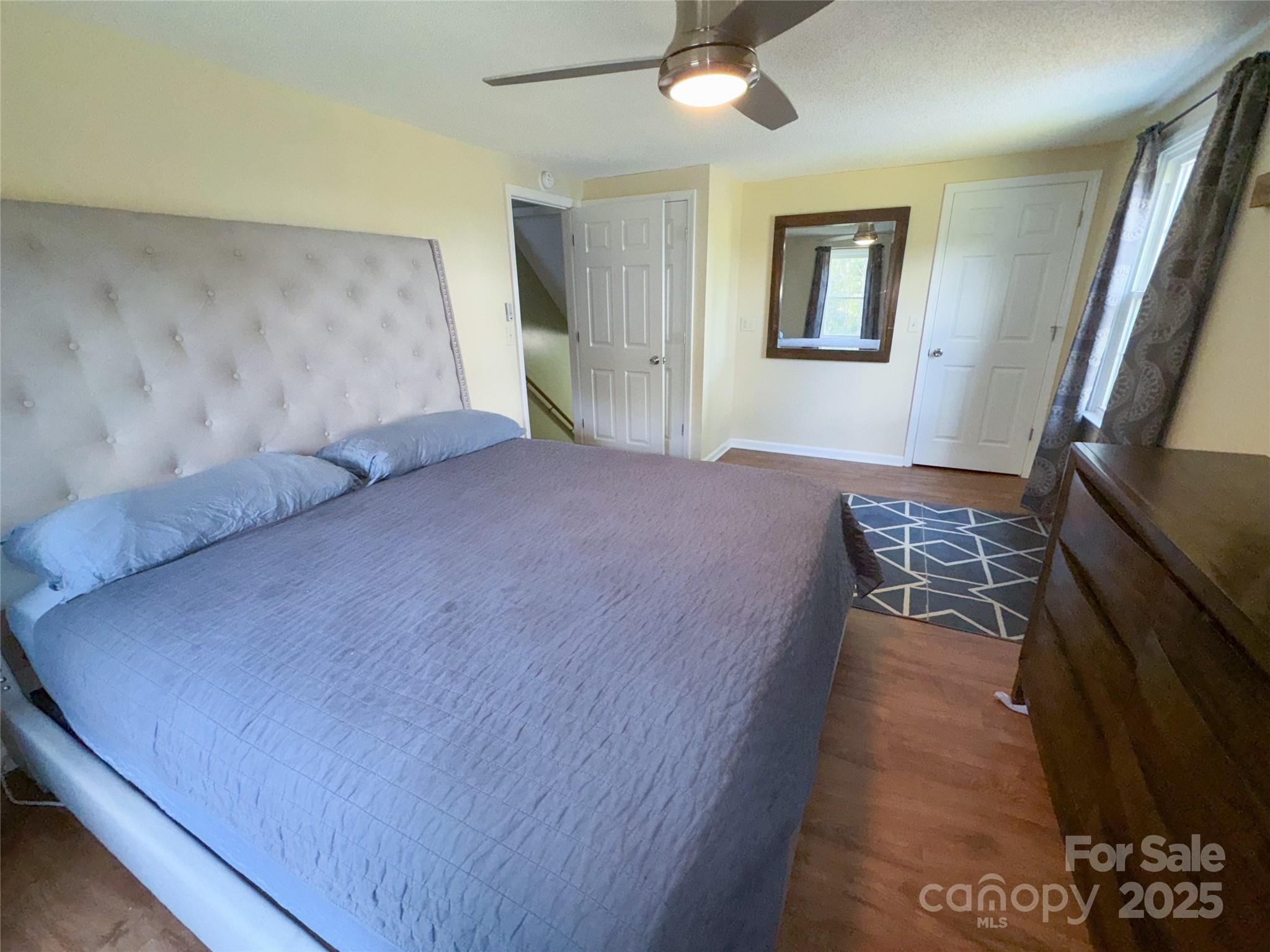 368 Gaddy Farm Road Mount Gilead, NC 27306 - Photo 13 of 25 a bedroom with a bed and a flat screen tv