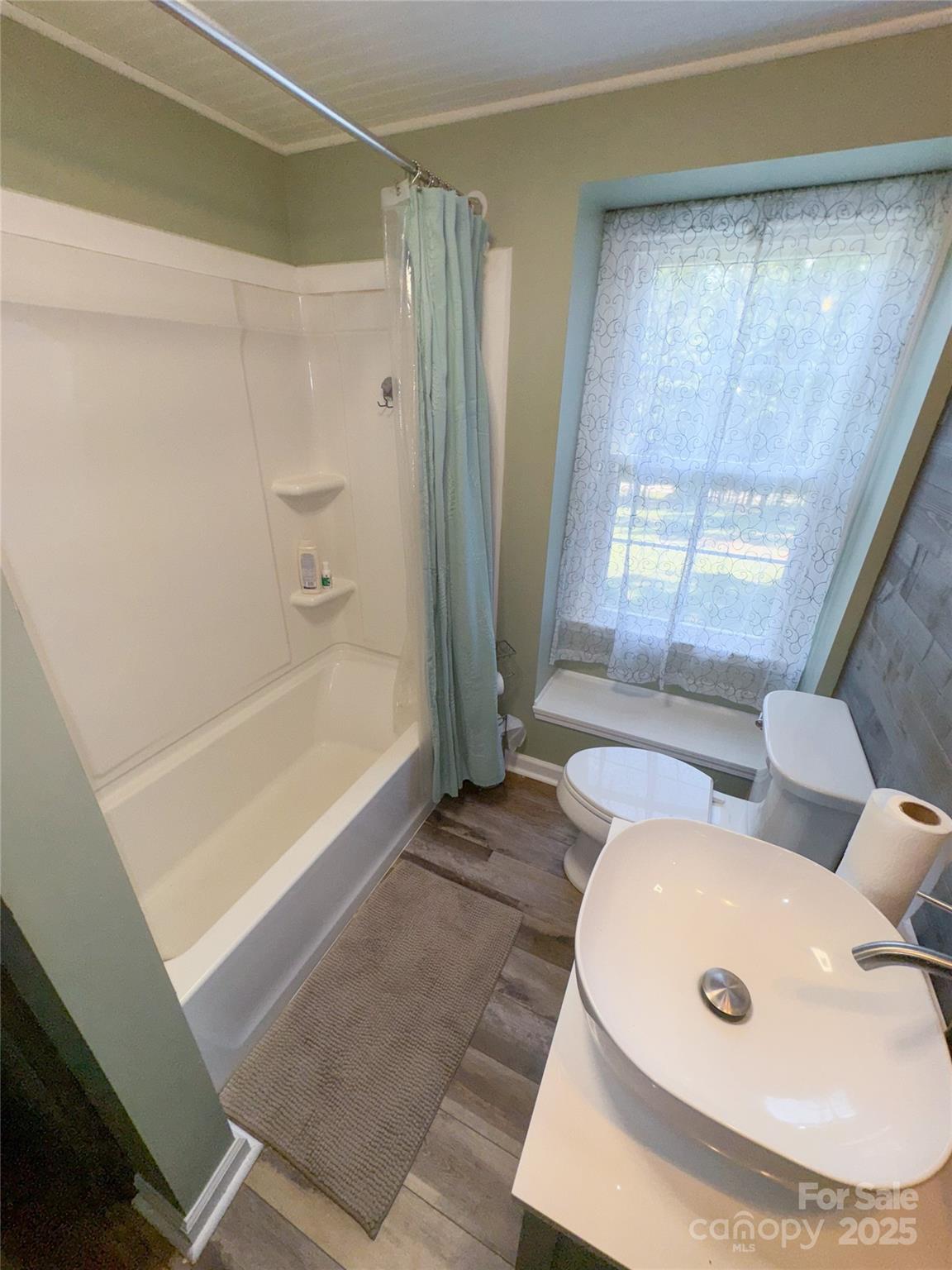 368 Gaddy Farm Road Mount Gilead, NC 27306 - Photo 15 of 25 a bathroom with a tub and a shower
