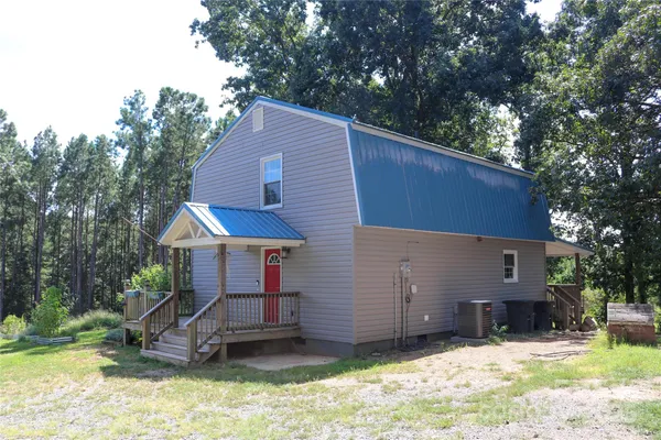a kitchen with stainless steel appliances granite countertop a stove a sink dishwasher and a refrigerator