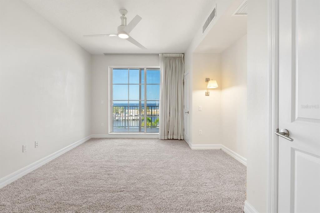 536 Bahia Beach Boulevard, Unit 222B Ruskin, FL 33570 - Photo 14 of 31 an empty room with windows and closet