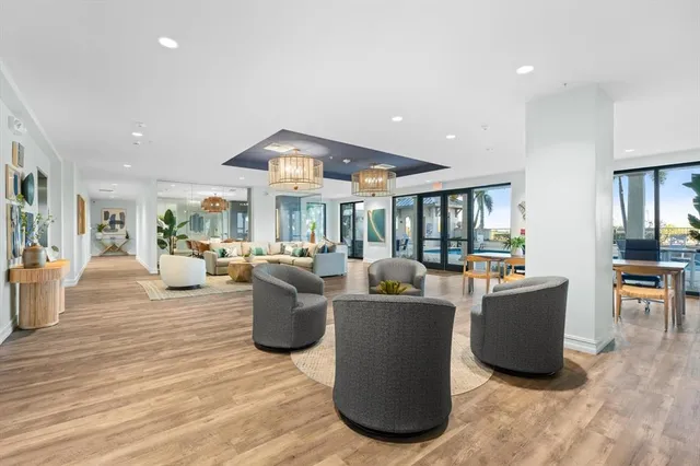 a living room with fireplace furniture and a table