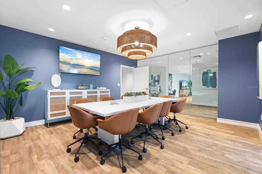 536 Bahia Beach Boulevard, Unit 222B Ruskin, FL 33570 - Photo 28 of 31 a view of a dining room with furniture and wooden floor