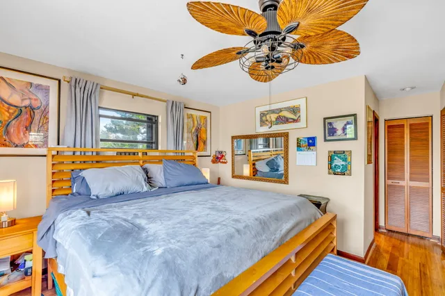 a view of a dining room with furniture large windows and wooden floor