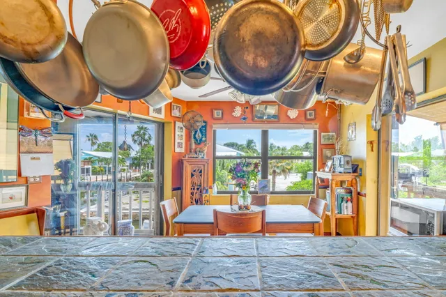 a kitchen with stainless steel appliances granite countertop a stove a sink and a granite counter tops