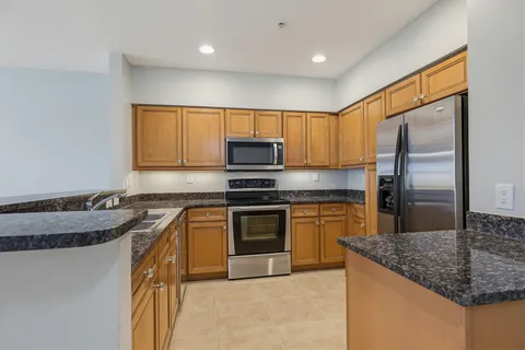 a view of a refrigerator in kitchen and a refrigerator