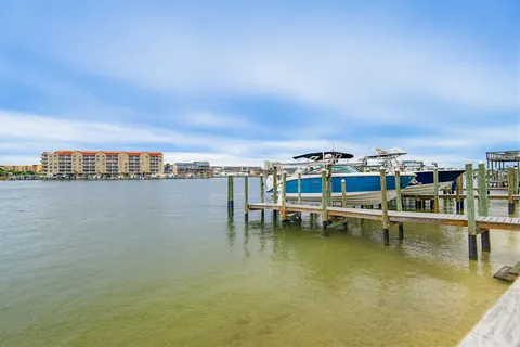a view of a lake with couches and city view