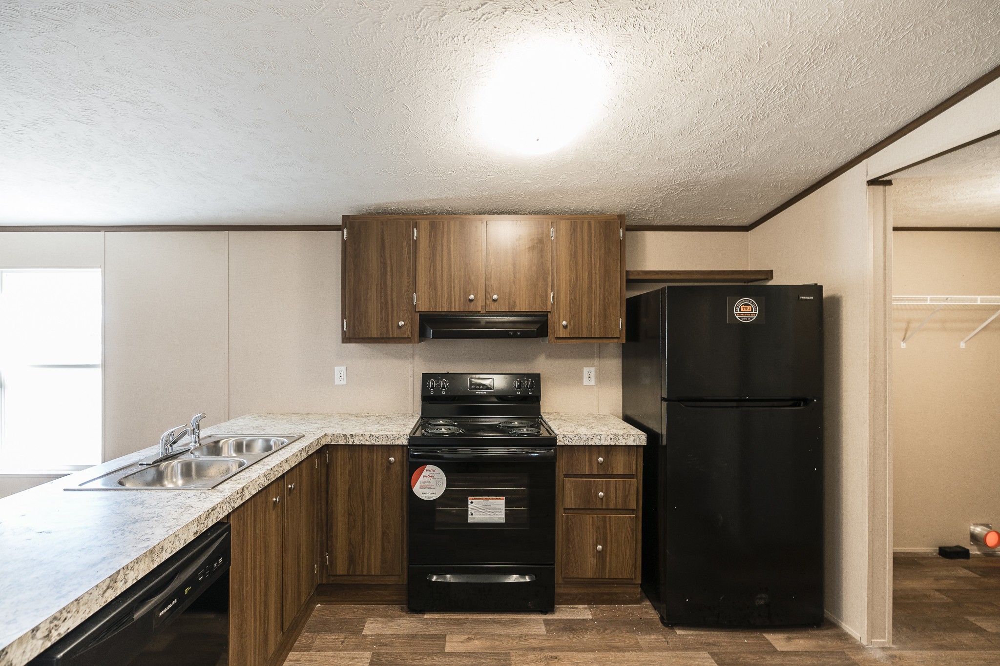 2552 Spring Street Pleasant View, TN 37146 - Photo 11 of 27 a kitchen with a refrigerator and a sink