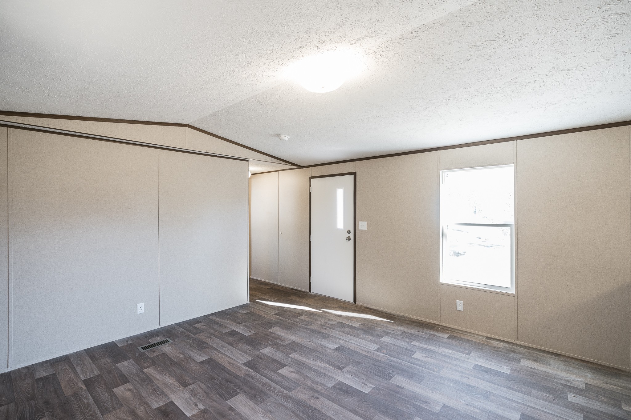 2552 Spring Street Pleasant View, TN 37146 - Photo 7 of 27 a view of an empty room with wooden floor and a window