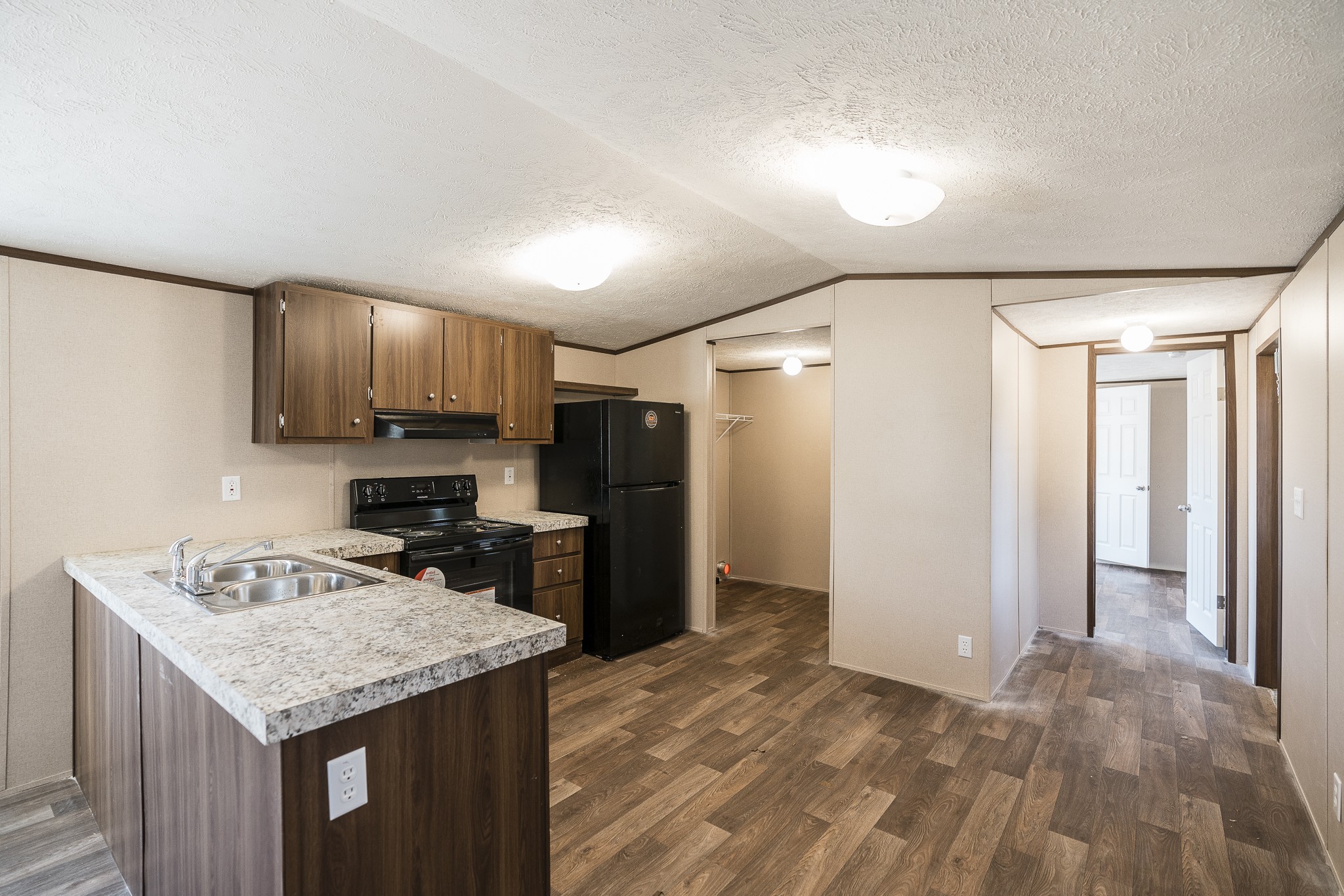 2552 Spring Street Pleasant View, TN 37146 - Photo 9 of 27 a kitchen with stainless steel appliances granite countertop a refrigerator a stove top oven a sink and dishwasher