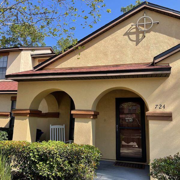 a front view of a house with garage