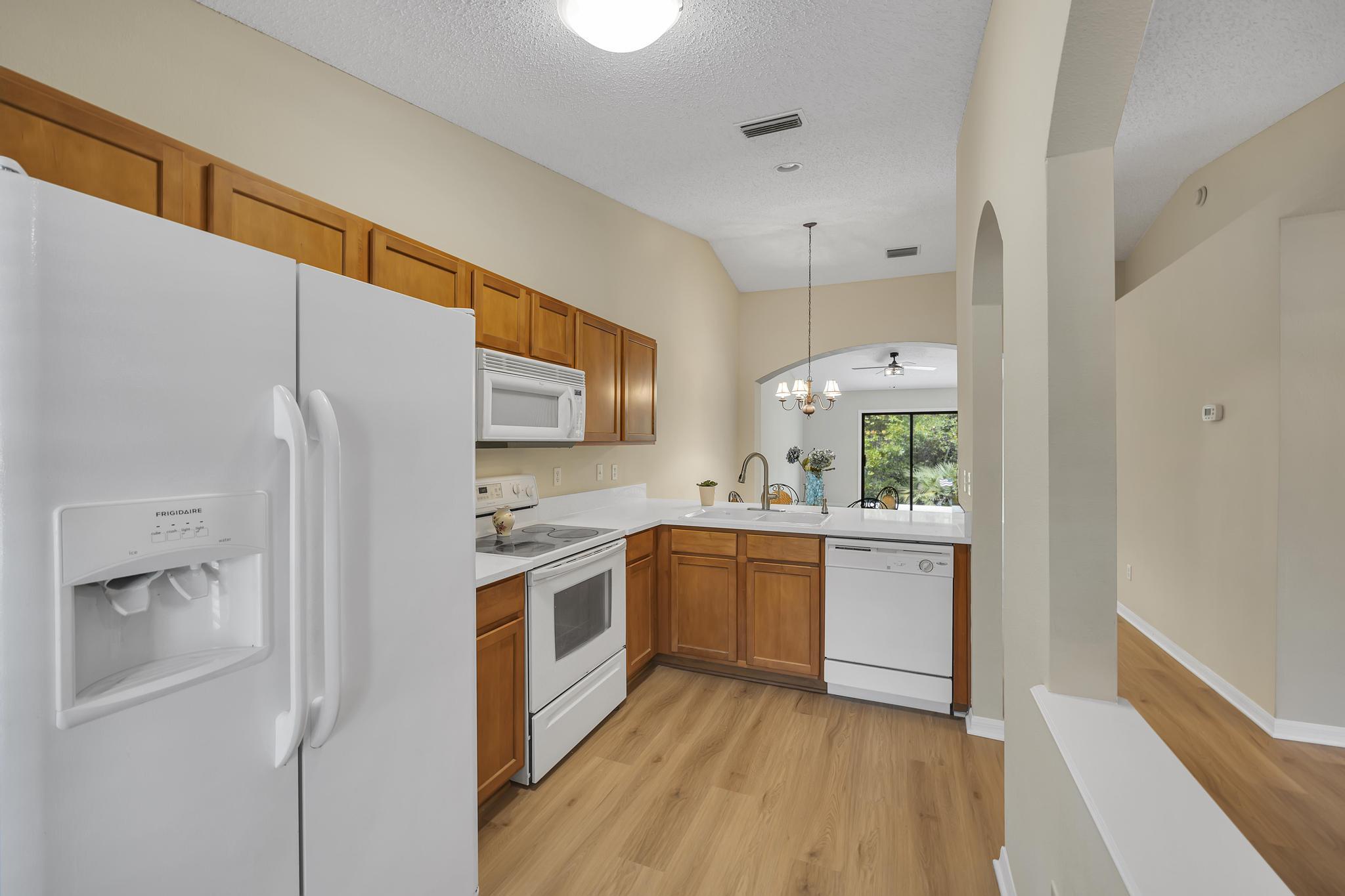 724 Ginger Mill Drive St. Johns, FL 32259 - Photo 14 of 54 a kitchen with stainless steel appliances granite countertop a stove and a refrigerator