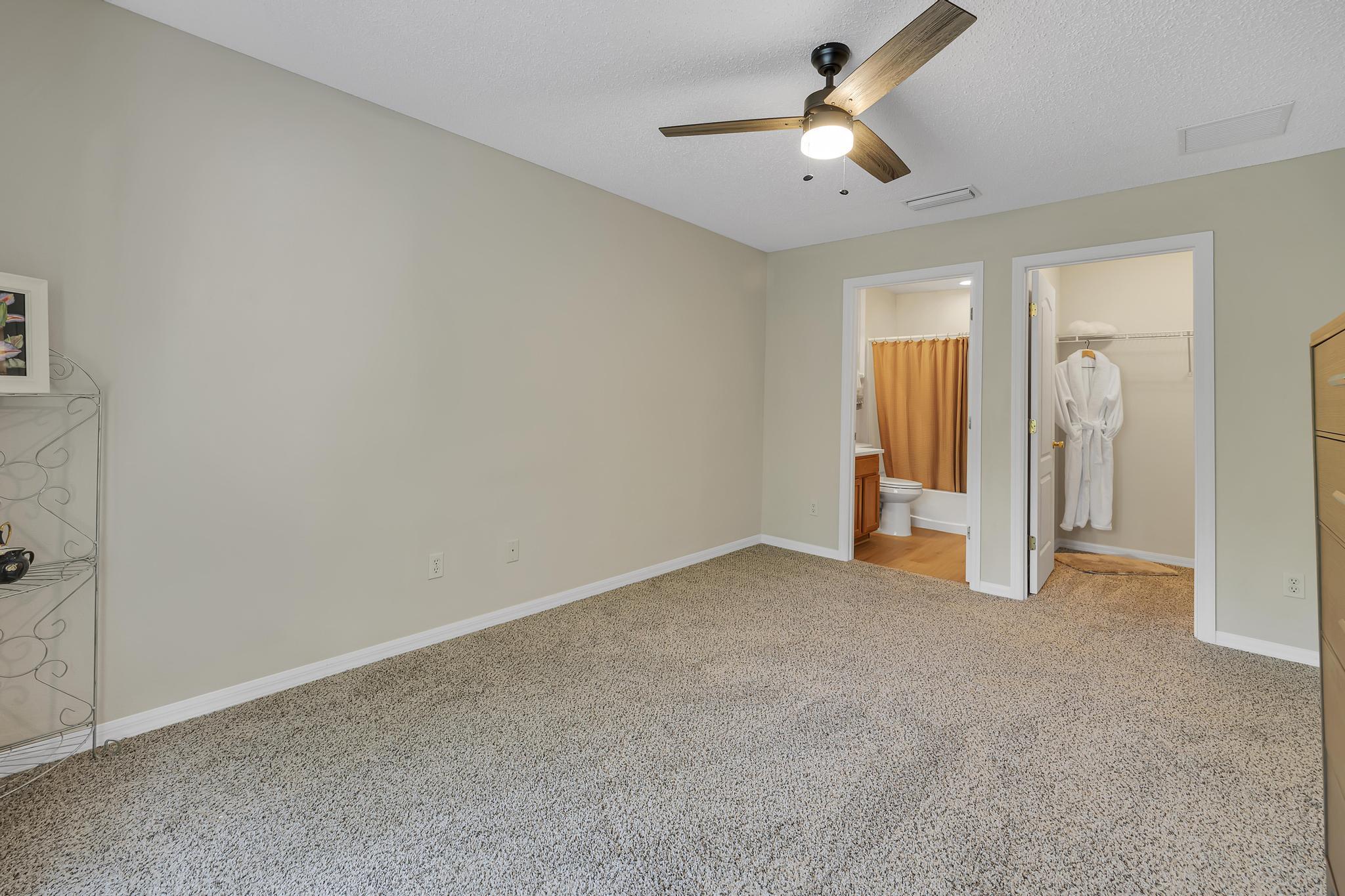 724 Ginger Mill Drive St. Johns, FL 32259 - Photo 15 of 54 an empty room with closet and a chandelier fan
