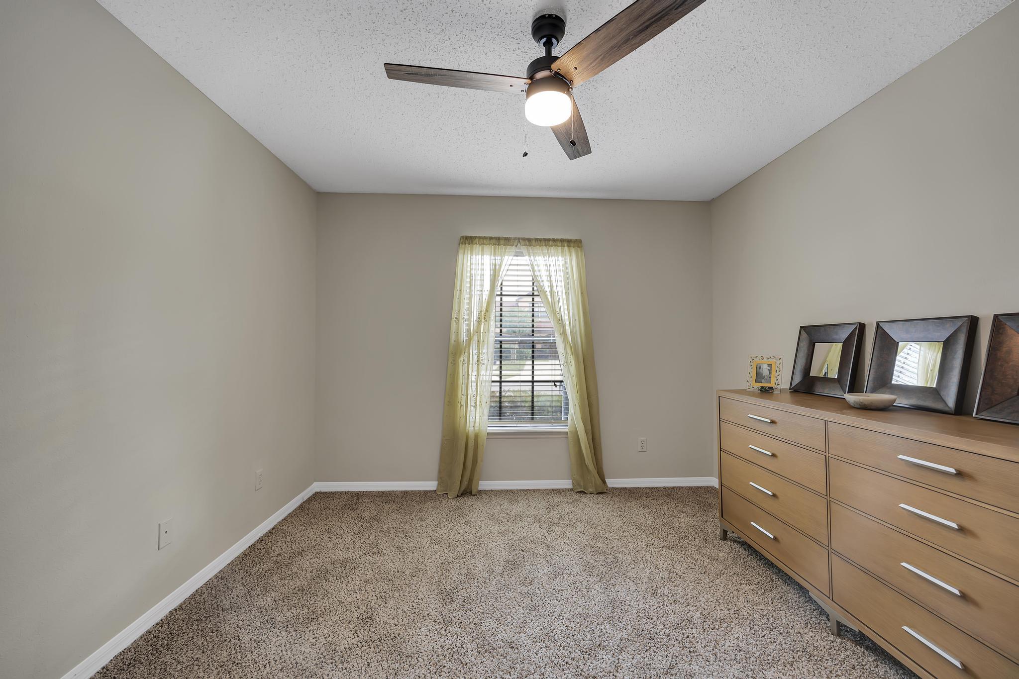 724 Ginger Mill Drive St. Johns, FL 32259 - Photo 20 of 54 a room with a dresser and a window