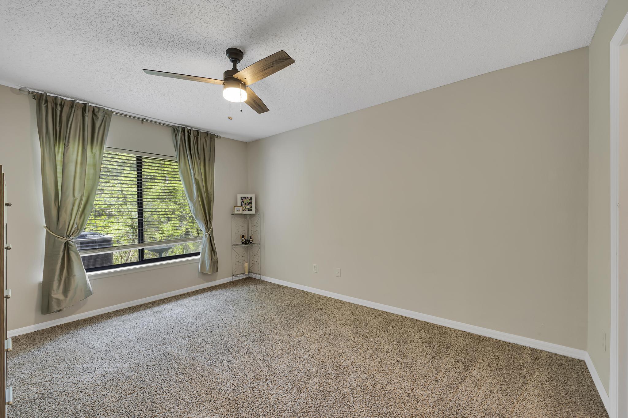 724 Ginger Mill Drive St. Johns, FL 32259 - Photo 21 of 54 a view of an empty room with a window